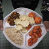 A new study offers hints that healthier school lunches may help reduce obesity
